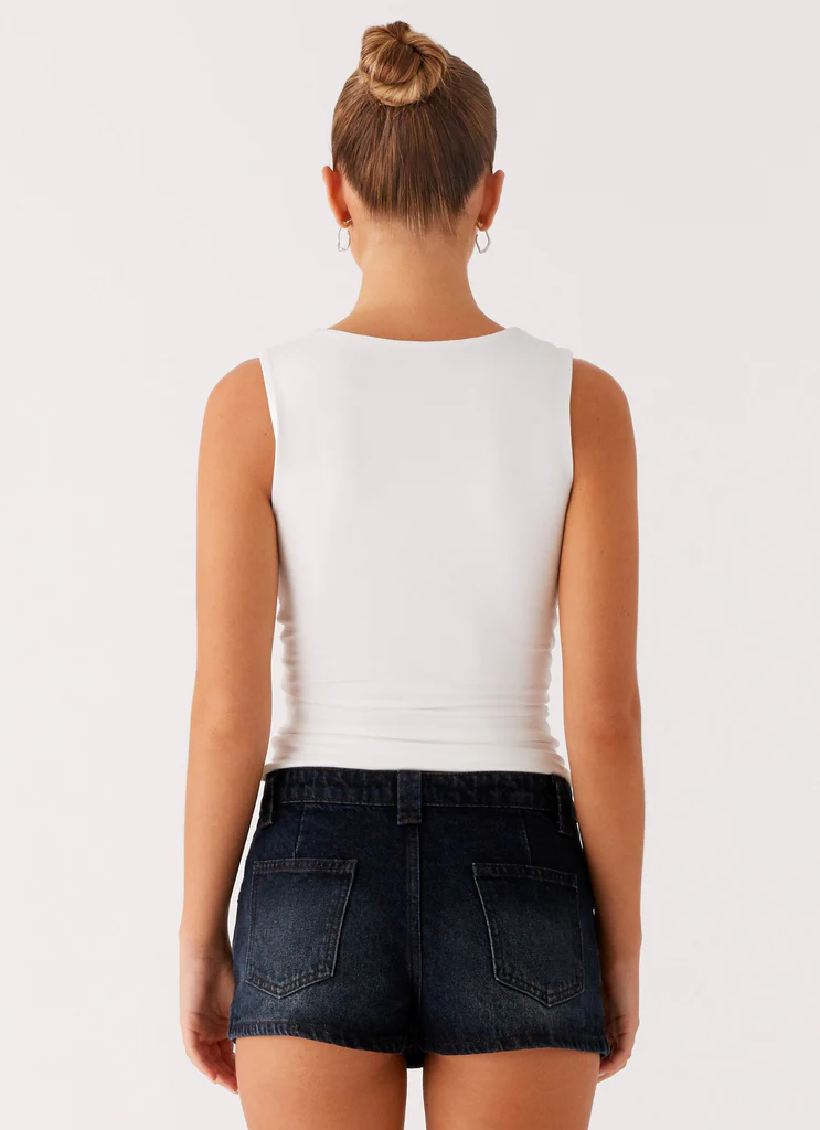 Mini-short en denim Tropics à taille basse - Bleu foncé lavé