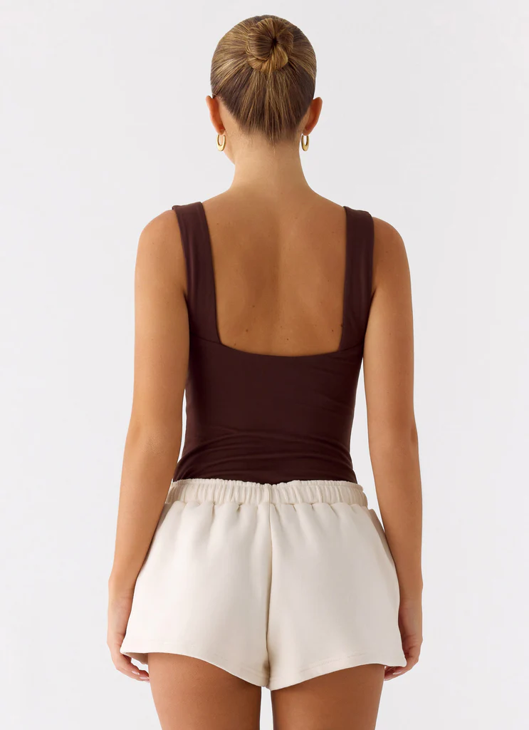 Shorts de sport à taille basse Signature - Crème